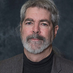 David, a white man with gray hair and beard.